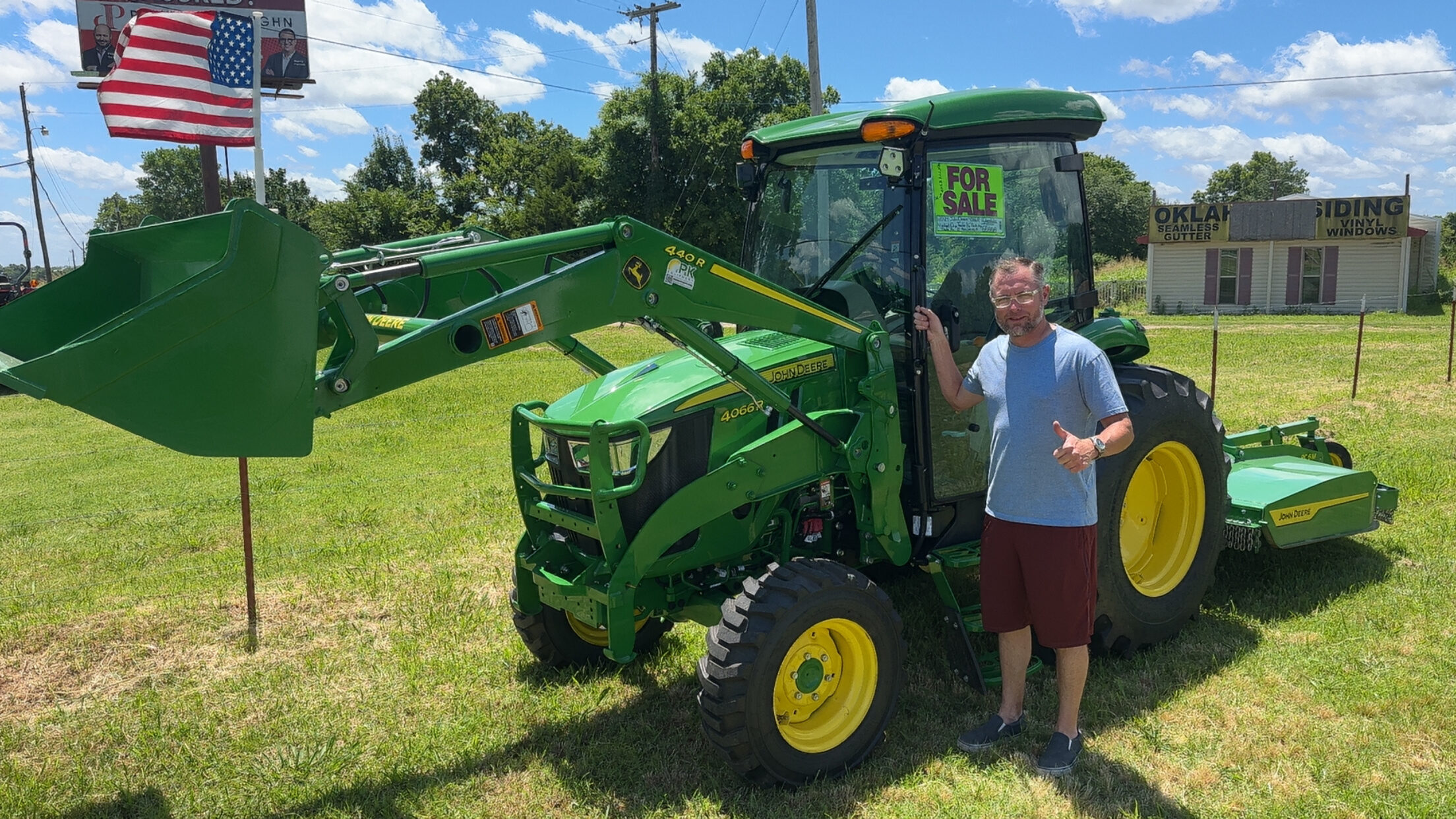 Happy customer poses with their vehicle purchased at KG Auto Sales lot.