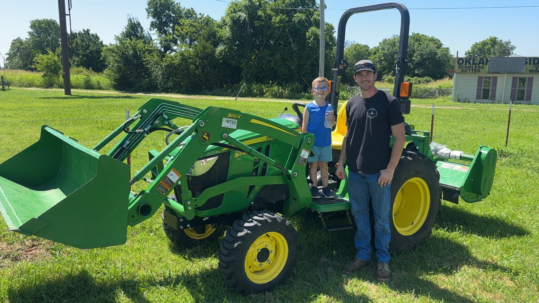 Happy customer poses with their vehicle purchased at KG Auto Sales lot.