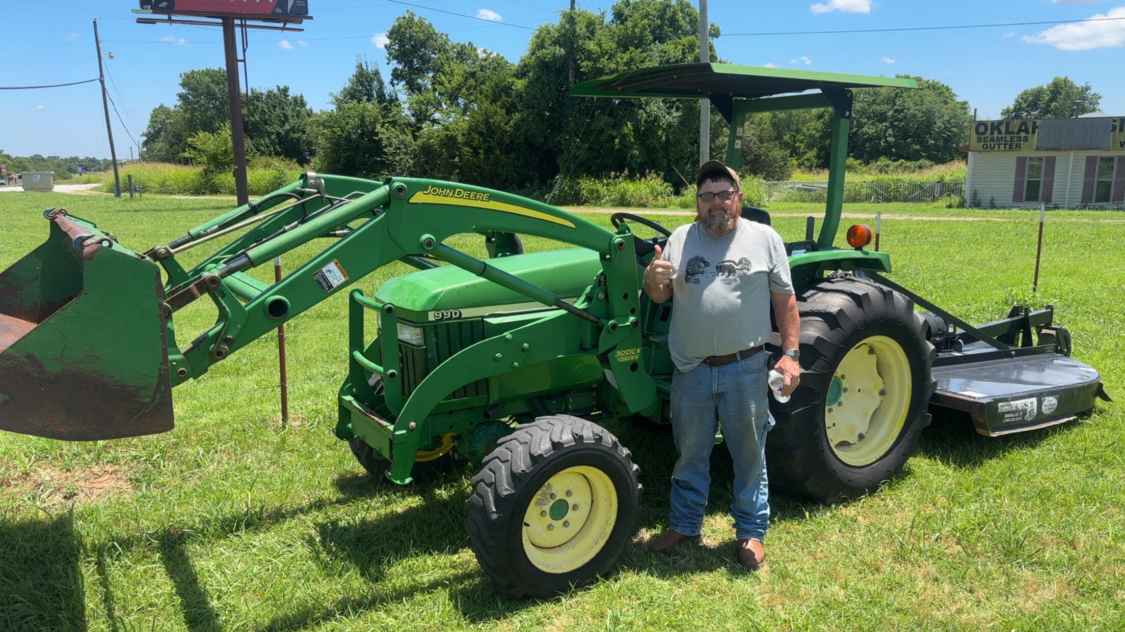 Happy customer poses with their vehicle purchased at KG Auto Sales lot.