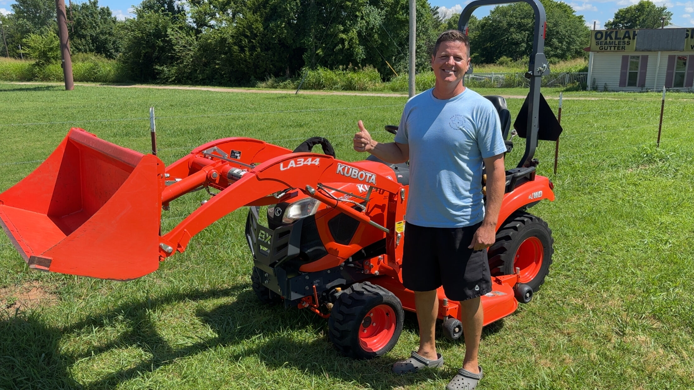 Happy customer poses with their vehicle purchased at KG Auto Sales lot.